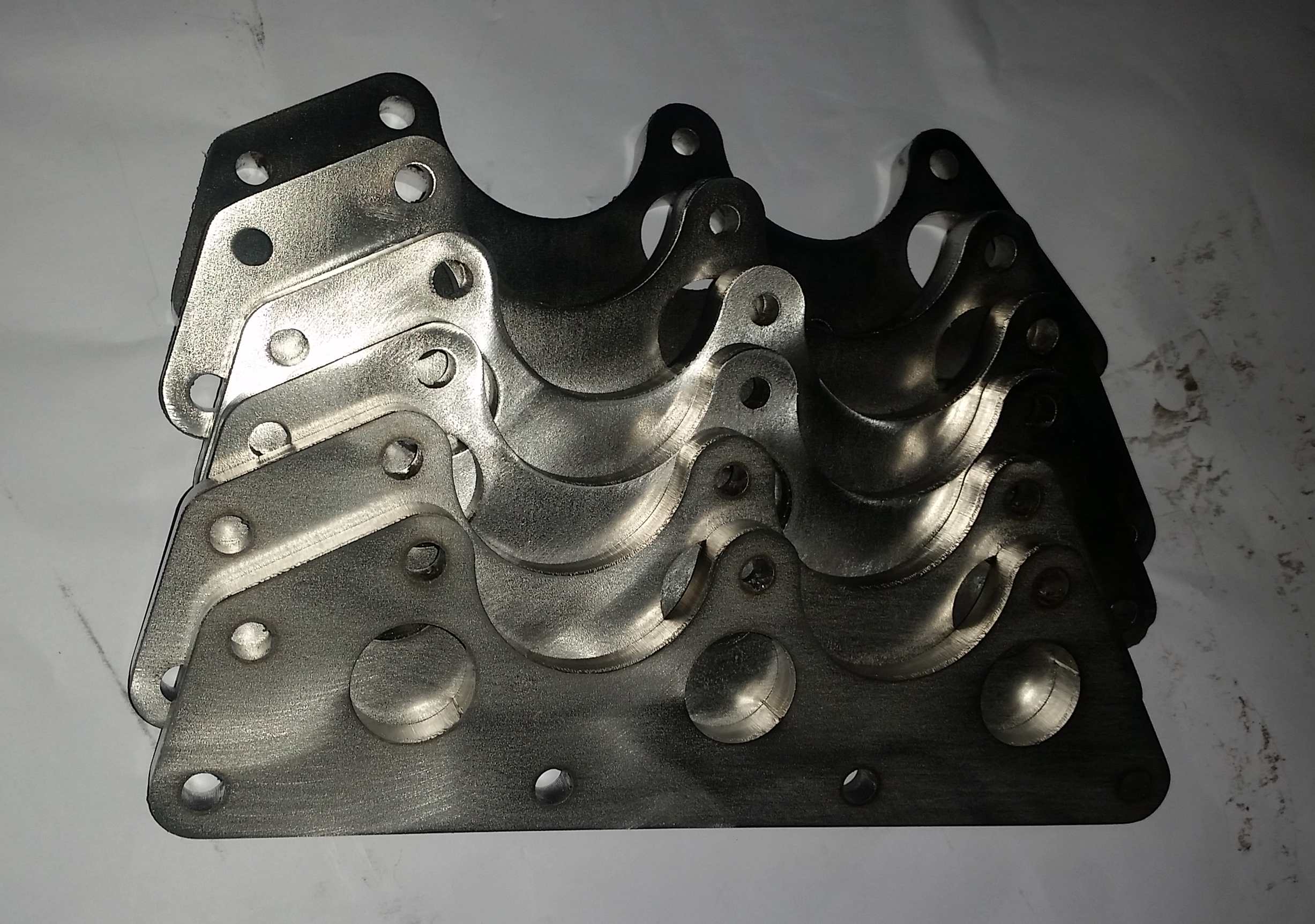 Exhaust manifold flange plate